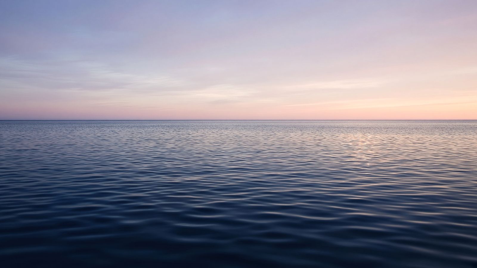 Calm Pacific ocean horizon at first light